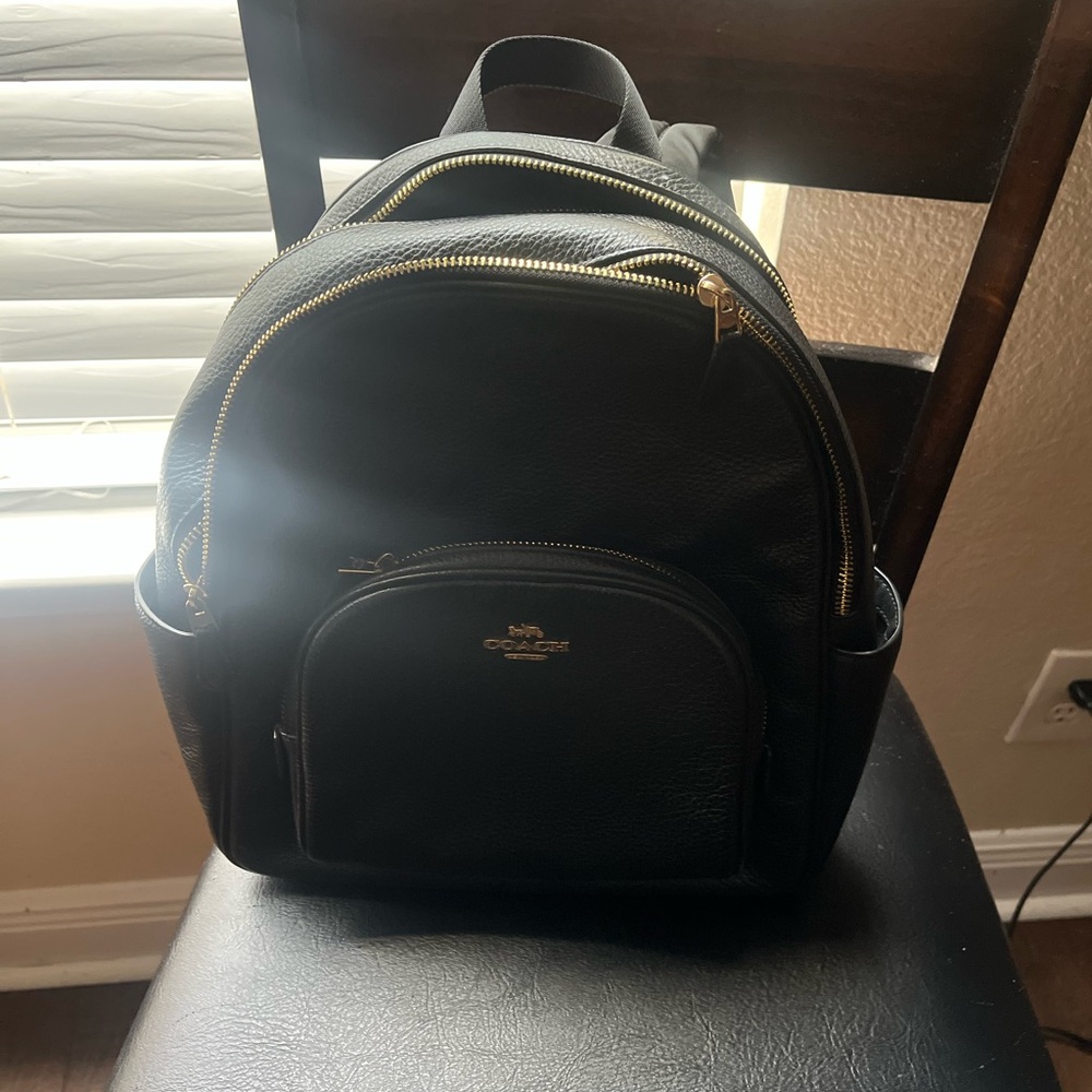 Coach Black Leather Men's Backpack with Gold Accents